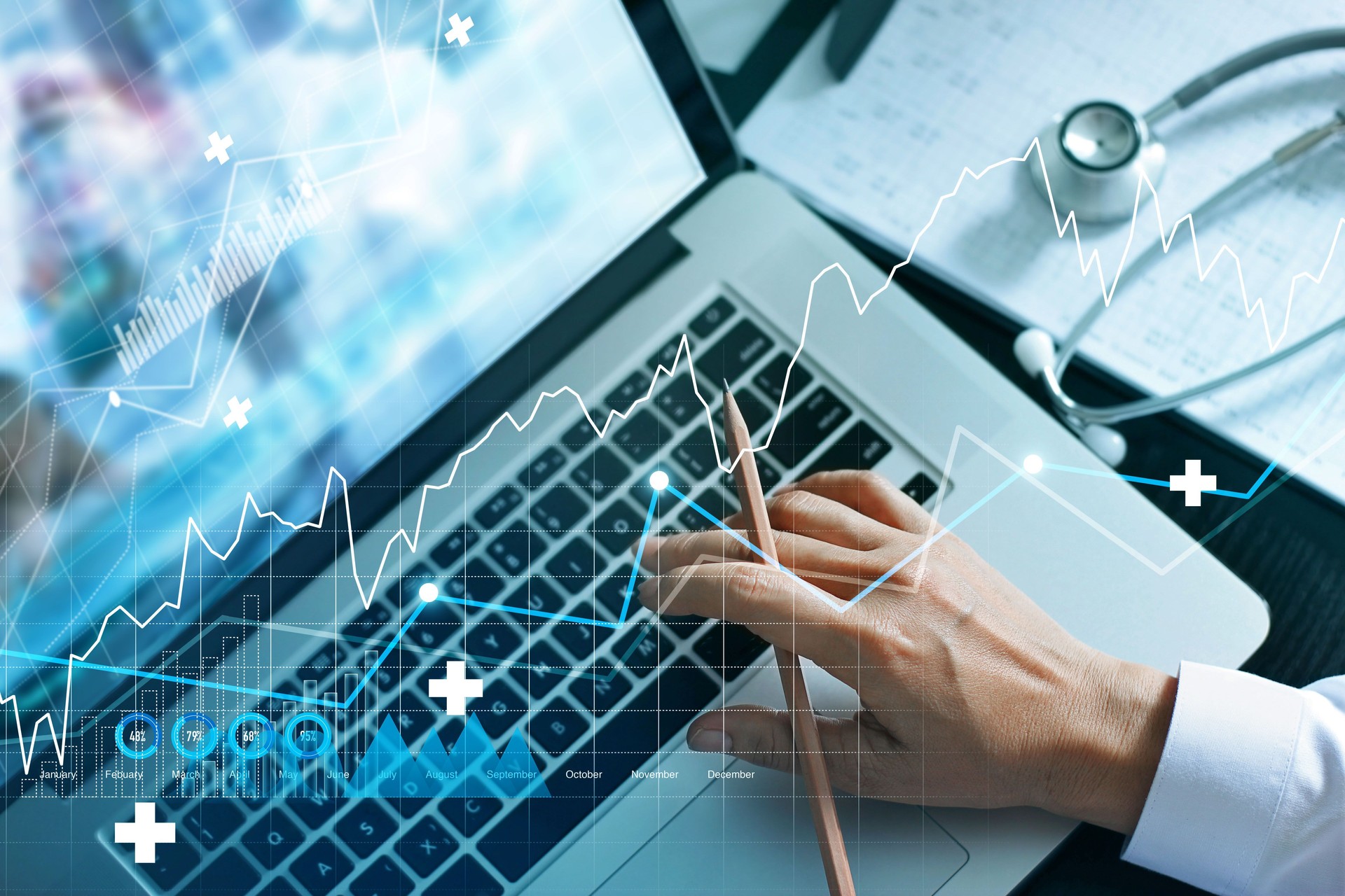 Analyzing data and growth chart healthcare business graph  and medical examination on laptop screen.